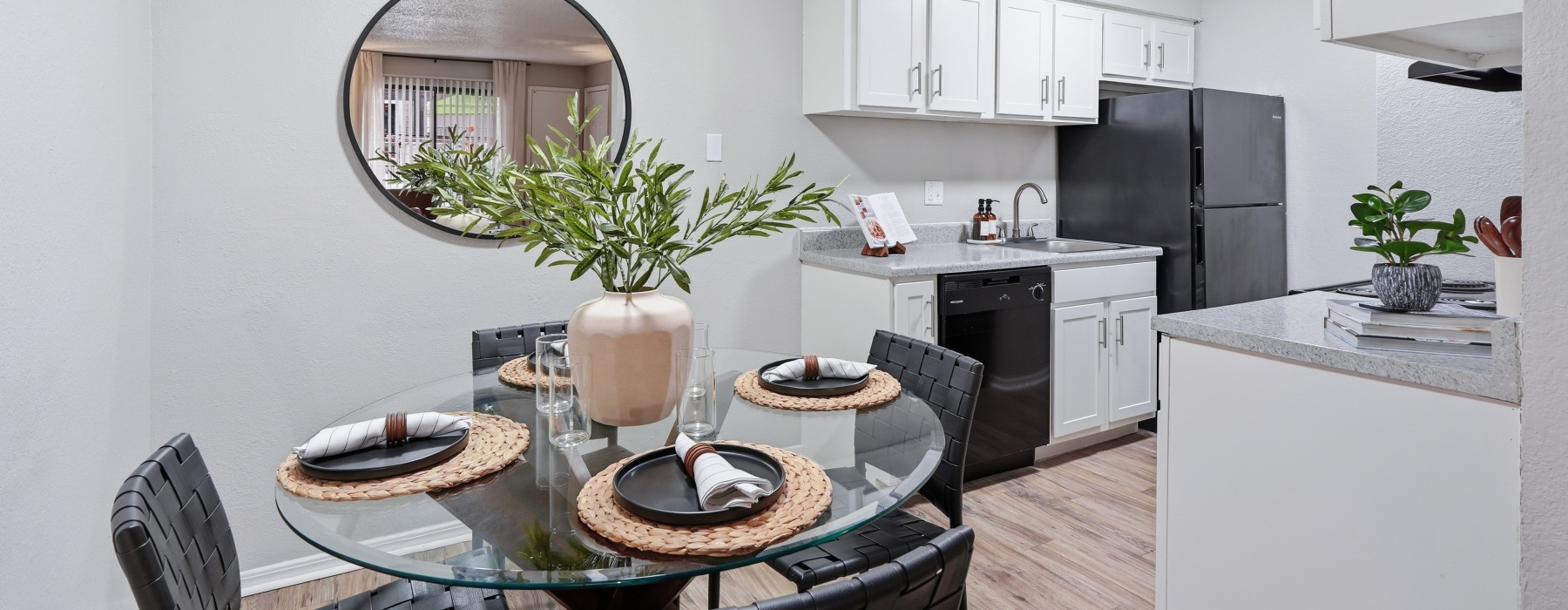 Diningroom with 4 seat table looking into kitchen 