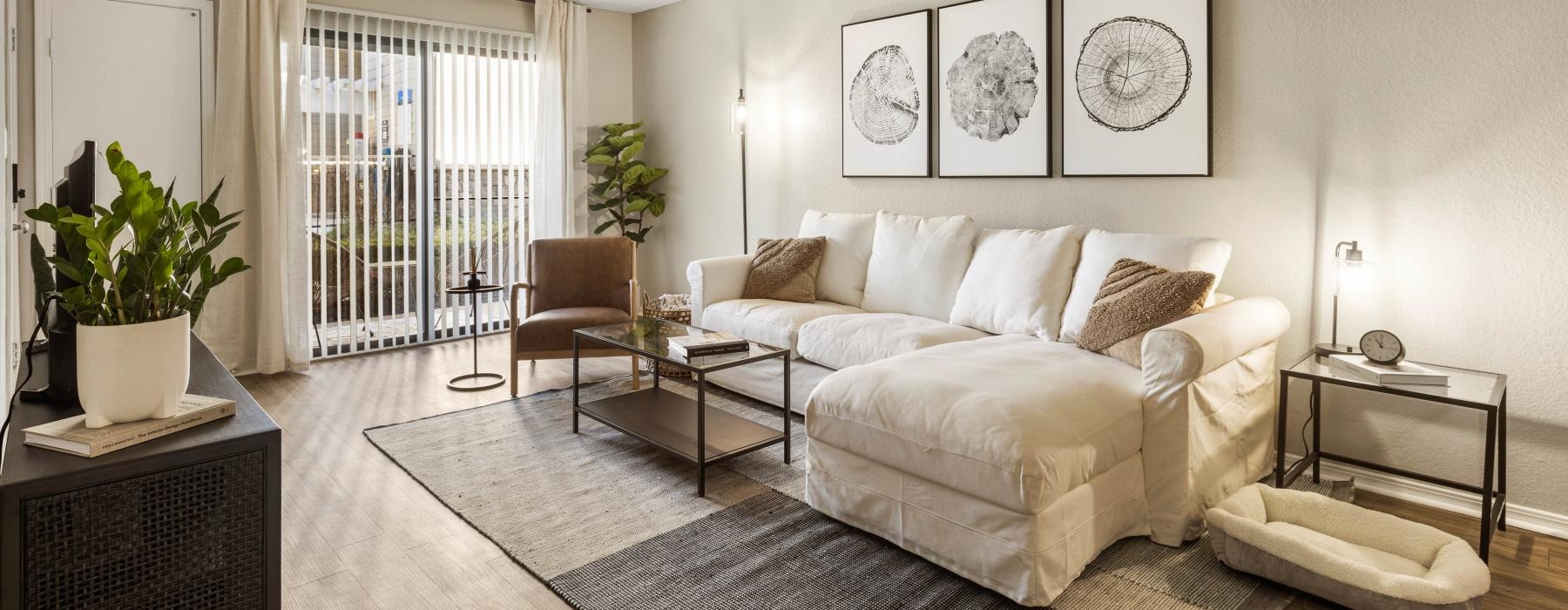 bright living room with sliding glass door