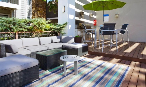 Outdoor patio with grill area at Woodland Trails, the best apartments in OKC.
