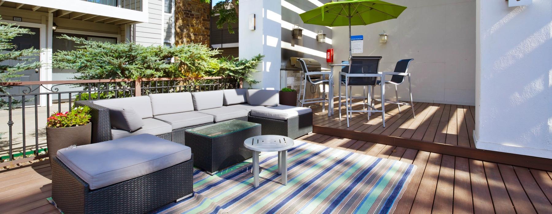 furnished deck with grill area