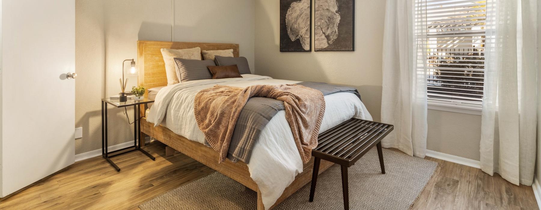 a bedroom with a bed and window